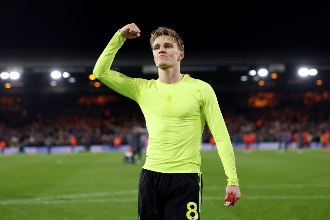 LUTON, ENGLAND - DECEMBER 05: Martin Odegaard of Arsenal celebrates victory in front of the fans of Arsenal after the Premier League match between Luton Town and Arsenal FC at Kenilworth Road on December 05, 2023 in Luton, England. (Photo by Julian Finney/Getty Images)
