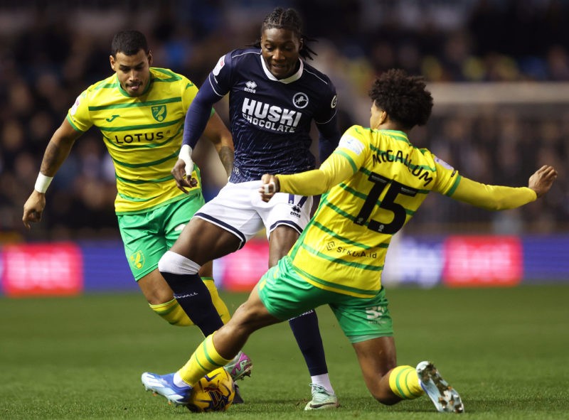 LONDON, ENGLAND - DECEMBER 29: Brooke Norton-Cuffy of Millwall is tackled by Sam McCallum of Norwich City during the Sky Bet Championship match between Millwall and Norwich City at The Den on December 29, 2023 in London, England. (Photo by Julian Finney/Getty Images)