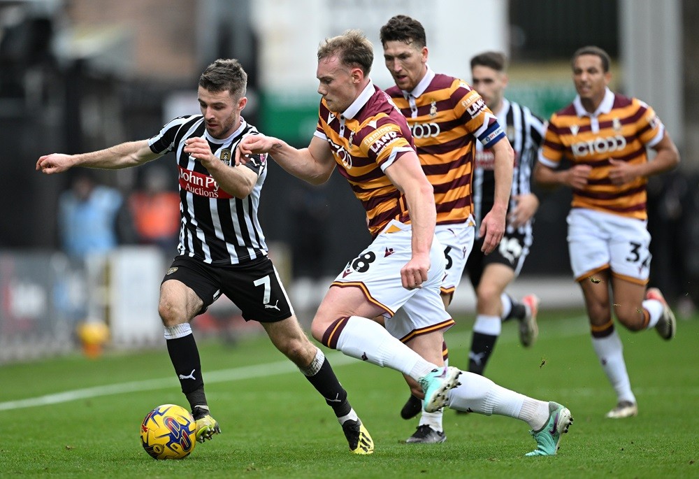 NOTTINGHAM, ENGLAND:  Dan Crowley of Notts County is challenged by Ciaran Kelly of Bradford City during the Sky Bet League Two match between Notts County and Bradford City at Meadow Lane on November 18, 2023. (Photo by Shaun Botterill/Getty Images)