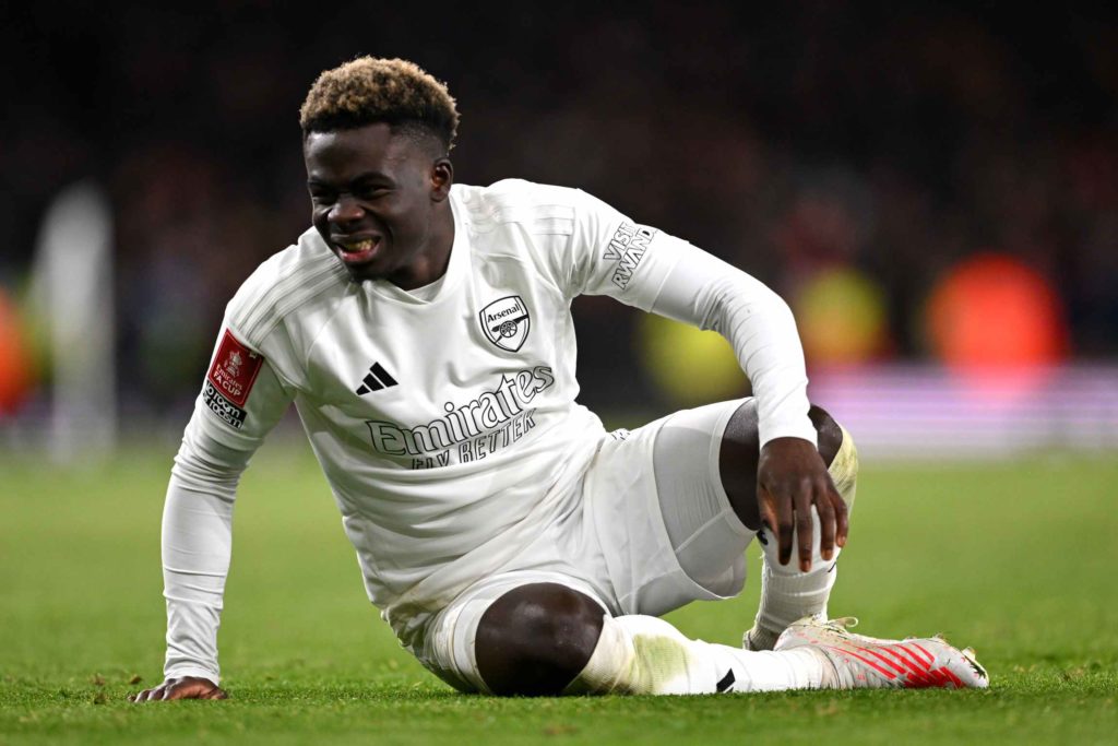 LONDON, ENGLAND - JANUARY 07: Bukayo Saka of Arsenal reacts during the Emirates FA Cup Third Round match between Arsenal and Liverpool at Emirates Stadium on January 07, 2024 in London, England. Arsenal wear an all-white kit at home, for the first time in the club's history, in support of the 'No More Red' campaign against knife crime and youth violence. (Photo by Shaun Botterill/Getty Images)