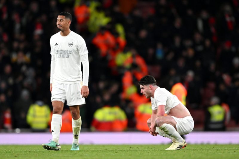 LONDON, ENGLAND - JANUARY 07: William Saliba and Declan Rice of Arsenal look dejected after the team's defeat in the Emirates FA Cup Third Round match between Arsenal and Liverpool at Emirates Stadium on January 07, 2024 in London, England. Arsenal wear an all-white kit at home, for the first time in the club's history, in support of the 'No More Red' campaign against knife crime and youth violence. (Photo by Shaun Botterill/Getty Images)