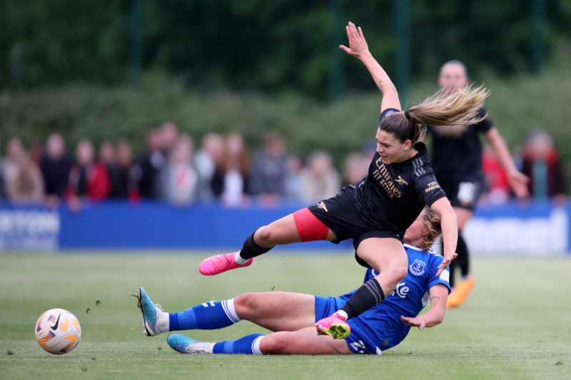 LIVERPOOL, ENGLAND - MAY 17: Gio Queiroz of Arsenal is tackled by Elise Stenevik of Everton during the FA Women's Super League match between Everton FC and Arsenal at Walton Hall Park on May 17, 2023 in Liverpool, England. (Photo by Jess Hornby/Getty Images)