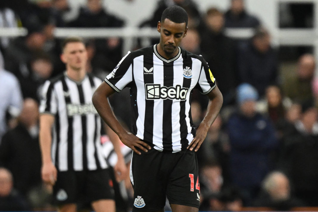 Newcastle United's Swedish striker #14 Alexander Isak reacts after they concede their third goal during the English Premier League football match between Newcastle United and Manchester City at St James' Park in Newcastle-upon-Tyne, north east England on January 13, 2024. Man City won the game 3-2. (Photo by OLI SCARFF/AFP via Getty Images)