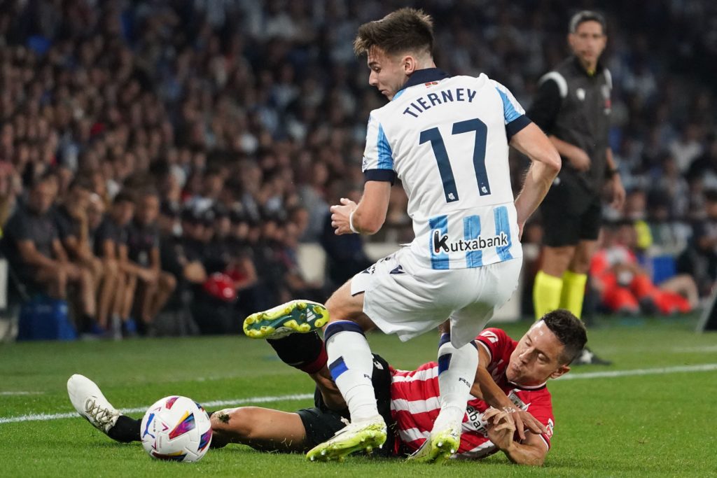 Real Sociedad's Scottish defender #17 Kieran Tierney fights for the ball with Athletic Bilbao's Spanish midfielder #21 Ander Herrera during the Spanish Liga football match between Real Sociedad and Athletic Club Bilbao at the Anoeta stadium in San Sebastian on September 30, 2023. (Photo by CESAR MANSO/AFP via Getty Images)
