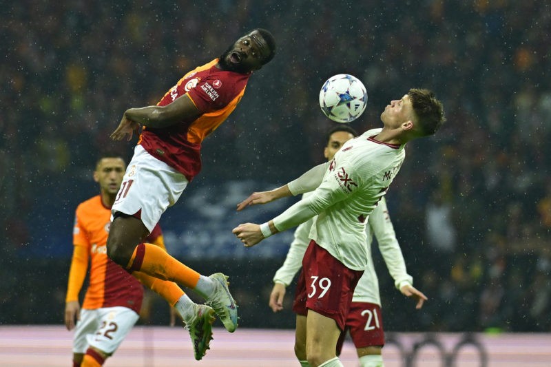Galatasaray's French midfielder #91 Tanguy NDombele Alvaro fights for the ball with Manchester United's Scottish midfielder #39 Scott McTominay during the UEFA Champions League 1st round, day 5, Group A football match between Galatasaray and Manchester United at Ali Sami Yen Spor Kompleksi in Istanbul, on November 29, 2023. (Photo by YASIN AKGUL/AFP via Getty Images)