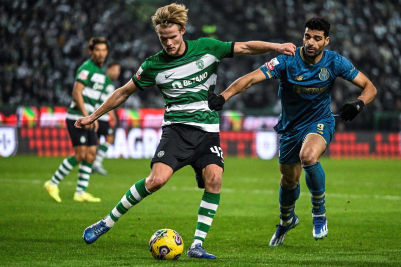 Sporting's Danish midfielder #42 Morten Hjulmand (L) vies with Porto's Iranian forward #09 Mehdi Taremi during the Portuguese League football match between Sporting CP and FC Porto at Alvalade stadium in Lisbon on December 18, 2023. (Photo by PATRICIA DE MELO MOREIRA/AFP via Getty Images)