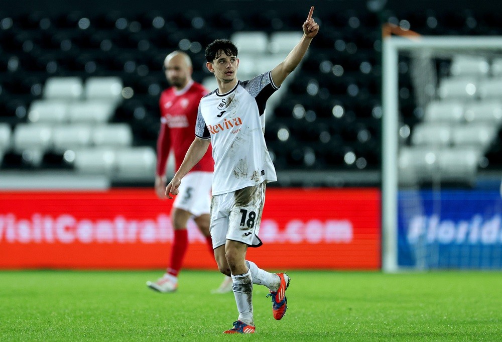 SWANSEA, WALES: Charlie Patino of Swansea City celebrates scoring his team's first goal during the Emirates FA Cup Third Round match between Swansea City and Morecambe at Swansea.com Stadium on January 06, 2024. (Photo by Eddie Keogh/Getty Images)