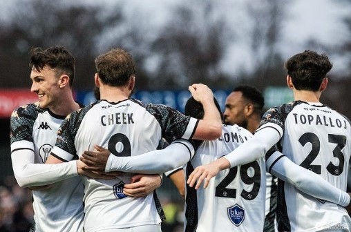 Alex Kirk (L) celebrates an assist for Bromley's late winner against Chesterfield (Photo via Kirk on his Instagram story)