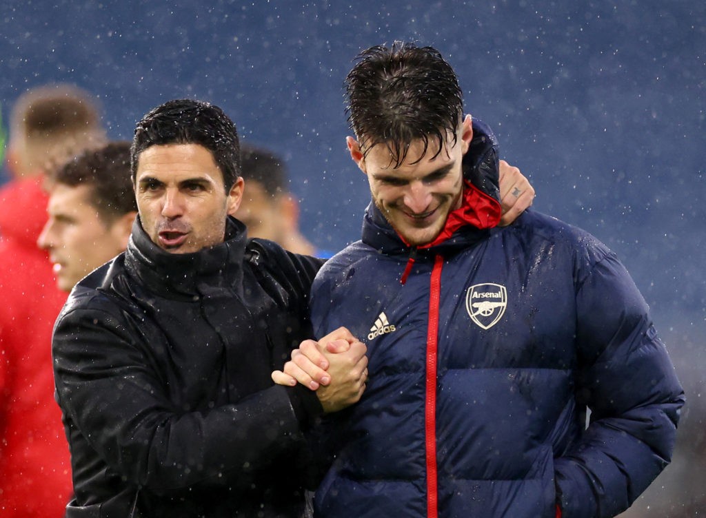 BURNLEY, ENGLAND - FEBRUARY 17: Mikel Arteta, Manager of Arsenal, embraces his players Declan Rice following the Premier League match between Burnley FC and Arsenal FC at Turf Moor on February 17, 2024 in Burnley, England. (Photo by Marc Atkins/Getty Images)