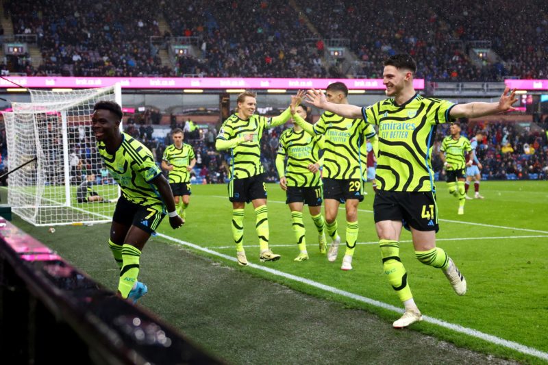 BURNLEY, ENGLAND - FEBRUARY 17: Bukayo Saka of Arsenal celebrates with teammates after scoring his team's third goal during the Premier League match between Burnley FC and Arsenal FC at Turf Moor on February 17, 2024 in Burnley, England. (Photo by Marc Atkins/Getty Images)