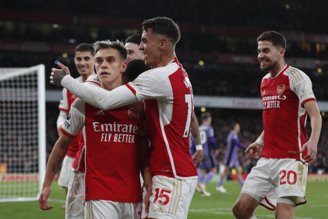 Arsenal's Belgian midfielder #19 Leandro Trossard (C) celebrates with teammates after scoring his team third goal during the English Premier League football match between Arsenal and Liverpool at the Emirates Stadium in London on February 4, 2024. (Photo by IAN KINGTON/IKIMAGES/AFP via Getty Images)