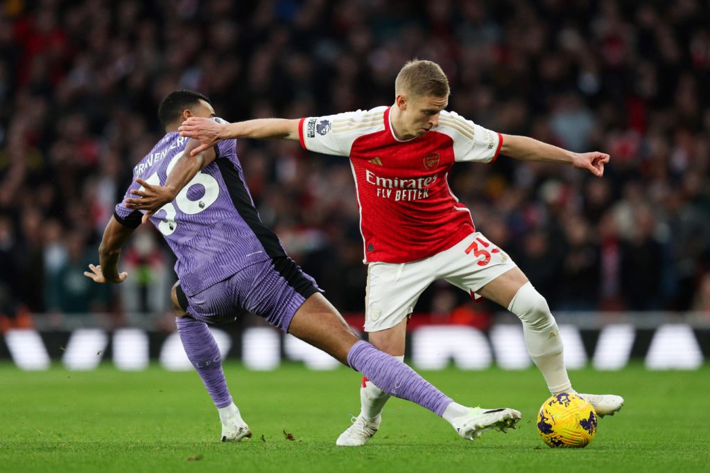 Liverpool's Dutch midfielder #38 Ryan Gravenberch (L) fights for the ball with Arsenal's Ukrainian defender #35 Oleksandr Zinchenko during the English Premier League football match between Arsenal and Liverpool at the Emirates Stadium in London on February 4, 2024. (Photo by ADRIAN DENNIS/AFP via Getty Images)