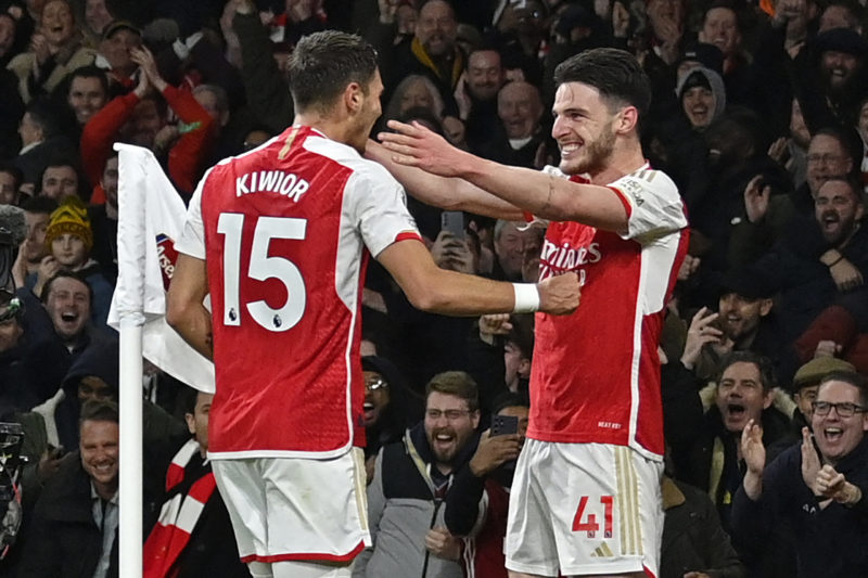 Arsenal's Polish defender #15 Jakub Kiwior (L) celebrates with Arsenal's English midfielder #41 Declan Rice (R) after scoring their fourth goal during the English Premier League football match between Arsenal and Newcastle United at the Emirates Stadium in London on February 24, 2024. (Photo by JUSTIN TALLIS/AFP via Getty Images)