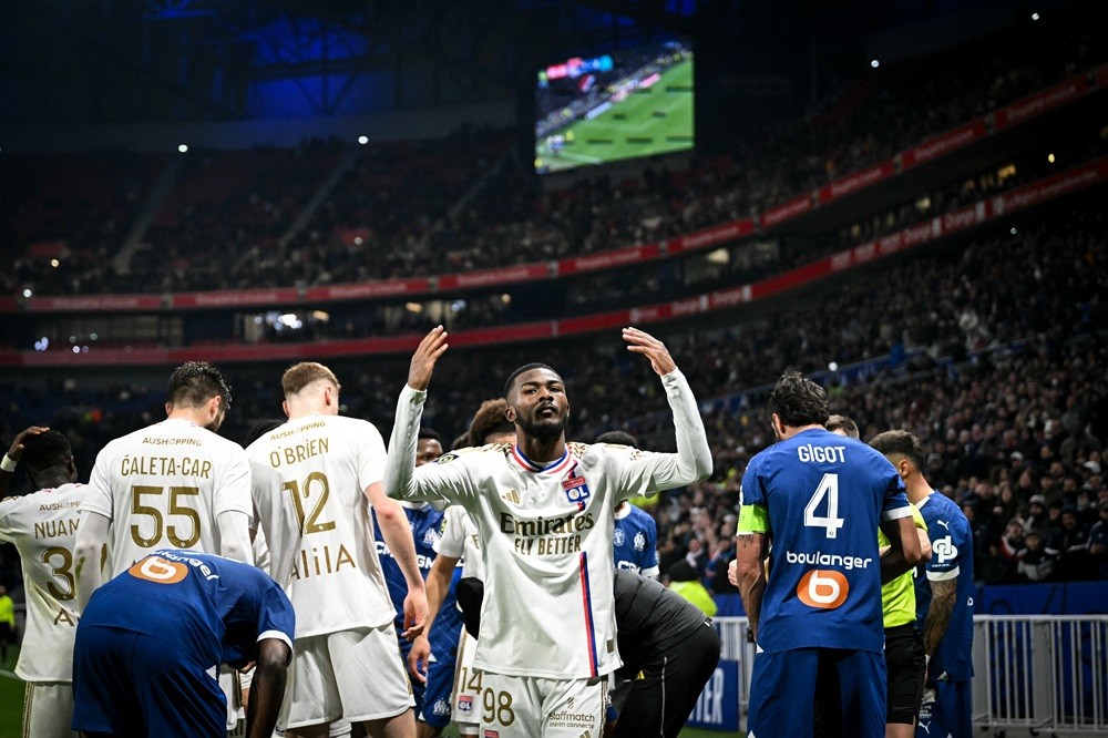 Lyon's Ainsley Maitland-Niles (C) reacts after the French L1 football match between Olympique Lyonnais (OL) and Olympique de Marseille (OM) at the Groupama Stadium in Decines-Charpieu, central-eastern France on February 4, 2024. (Photo by OLIVIER CHASSIGNOLE/AFP via Getty Images)