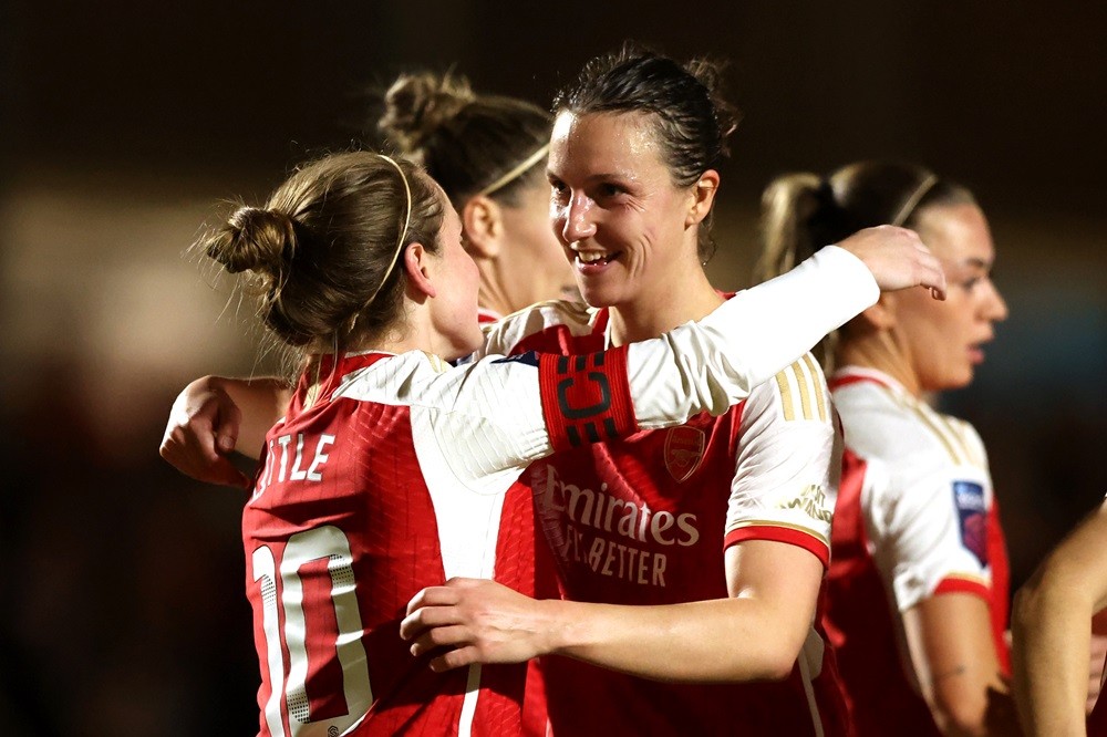 DARTFORD, ENGLAND: Kim Little of Arsenal celebrates scoring her team's second goal with teammate Lotte Wubben-Moy of Arsenal during the FA Women's Continental Tyres League Cup Quarter Final match between London City Lionesses and Arsenal at Princes Park on February 14, 2024. (Photo by Richard Pelham/Getty Images)