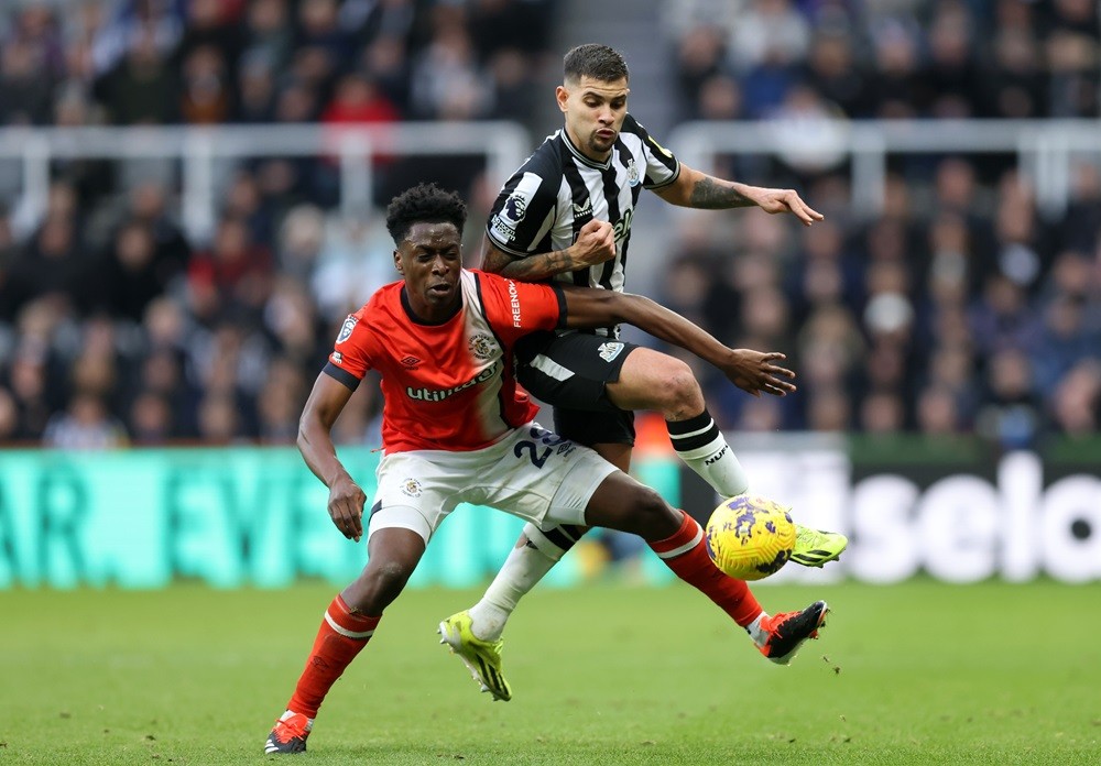 NEWCASTLE UPON TYNE, ENGLAND: Albert Sambi Lokonga of Luton Town clashes with Bruno Guimaraes of Newcastle United during the Premier League match between Newcastle United and Luton Town at St. James Park on February 03, 2024. (Photo by George Wood/Getty Images)