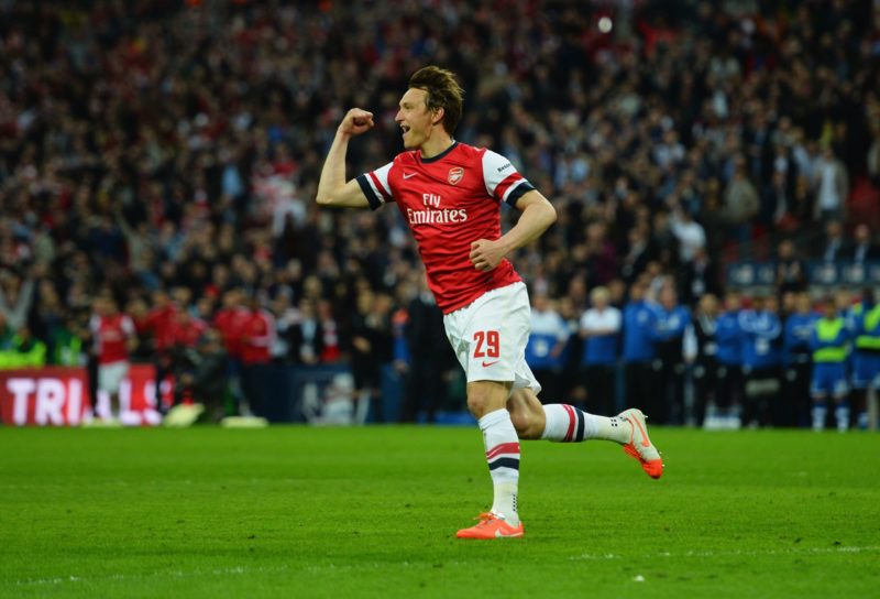 LONDON, ENGLAND - APRIL 12: Kim Kallstrom of Arsenal celebrates scoring in the penalty shoot during the FA Cup Semi-Final match between Wigan Athletic and Arsenal at Wembley Stadium on April 12, 2014 in London, England. (Photo by Shaun Botterill/Getty Images)