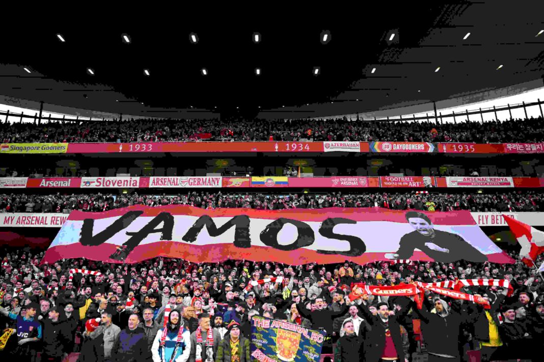LONDON, ENGLAND - MARCH 09: Arsenal fans show their support and hold up a banner reading 