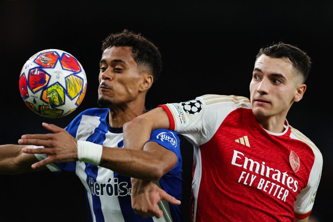 Porto's Portuguese striker #70 Goncalo Borges (L) fights for the ball with Arsenal's Polish defender #15 Jakub Kiwior during the UEFA Champions League last 16 second leg football match between Arsenal and Porto FC at the Arsenal Stadium in north London, on March 12, 2024. (Photo by ADRIAN DENNIS/AFP via Getty Images)