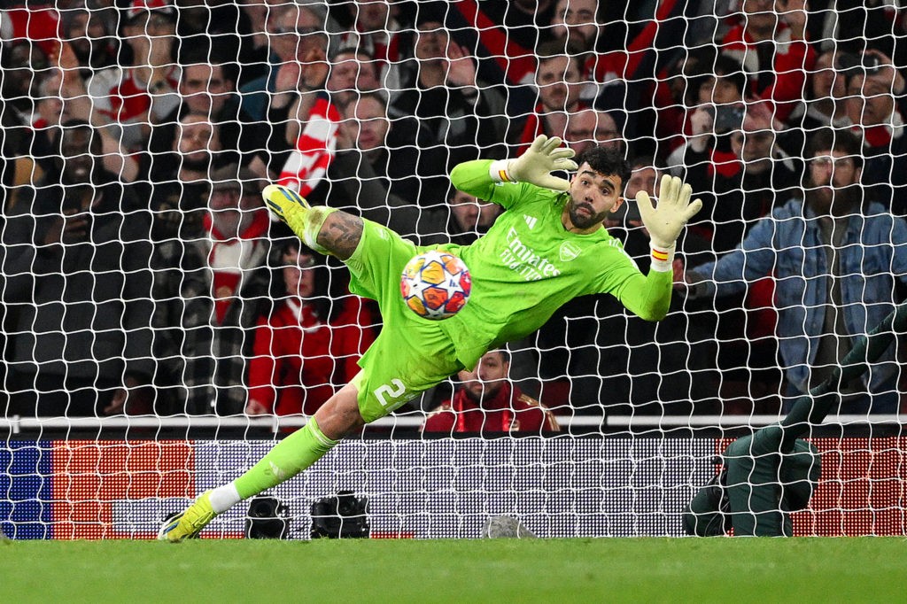 LONDON, ENGLAND - MARCH 12: David Raya of Arsenal makes the match-winning save from the fourth penalty from Galeno of FC Porto (not pictured) in the penalty shoot out during the UEFA Champions League 2023/24 round of 16 second leg match between Arsenal FC and FC Porto at Emirates Stadium on March 12, 2024 in London, England. (Photo by Shaun Botterill/Getty Images)