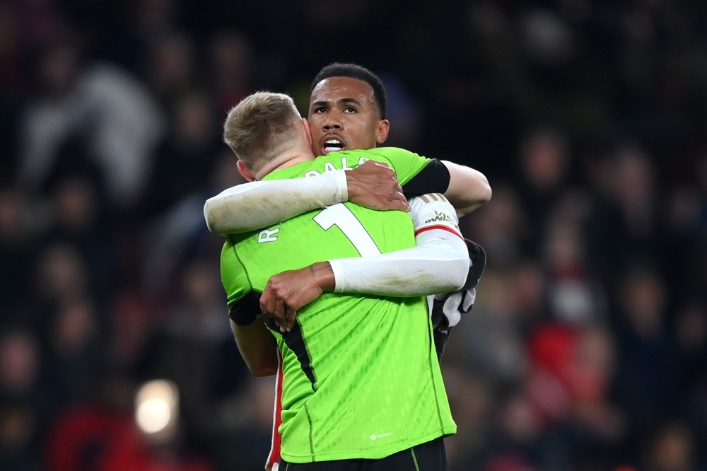 LONDON, ENGLAND: Aaron Ramsdale and Gabriel of Arsenal celebrate victory in the Premier League match between Arsenal FC and Brentford FC at Emirates Stadium on March 09, 2024. (Photo by Justin Setterfield/Getty Images)
