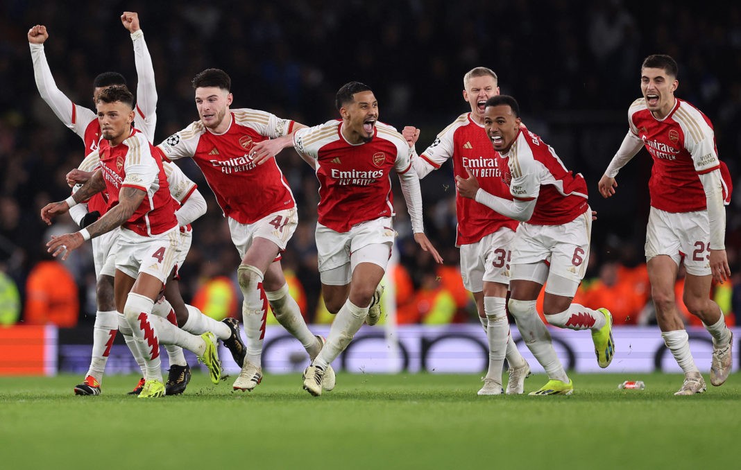 LONDON, ENGLAND - MARCH 12: The players of Arsenal celebrate as David Raya of Arsenal (not pictured) makes the match-winning save from the fourth penalty from Galeno of FC Porto (not pictured) in the penalty shoot out during the UEFA Champions League 2023/24 round of 16 second leg match between Arsenal FC and FC Porto at Emirates Stadium on March 12, 2024 in London, England. (Photo by Julian Finney/Getty Images)