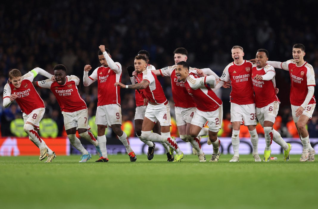 LONDON, ENGLAND - MARCH 12: The players of Arsenal celebrate as David Raya of Arsenal (not pictured) makes the match-winning save from the fourth penalty from Galeno of FC Porto (not pictured) in the penalty shoot out during the UEFA Champions League 2023/24 round of 16 second leg match between Arsenal FC and FC Porto at Emirates Stadium on March 12, 2024 in London, England. (Photo by Julian Finney/Getty Images)