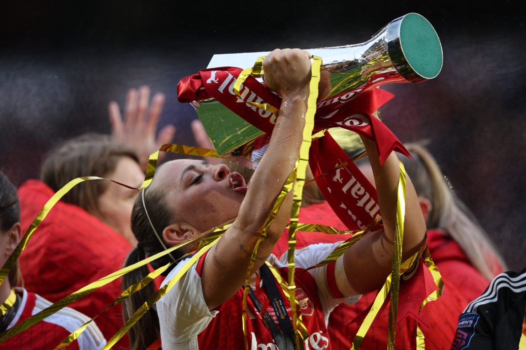 Arsenal's Irish striker #15 Katie McCabe takes a drink from the trophy as Arsenal's players celebrate their win after the English Women's League Cup final football match between Arsenal and Chelsea at Molineux in Wolverhampton, central England on March 31, 2024. Arsenal won the game 1-0 after extra time. (Photo by ADRIAN DENNIS/AFP via Getty Images)