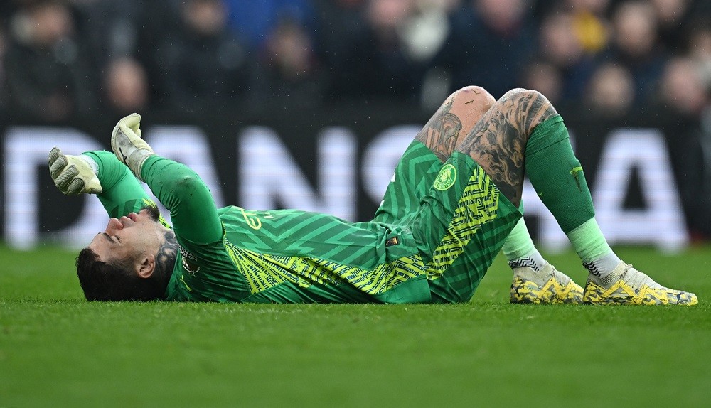 Manchester City's Ederson reacts before leaving the pitch injured during the English Premier League football match between Liverpool and Manchester City at Anfield in Liverpool, north west England on March 10, 2024. (Photo by PAUL ELLIS/AFP via Getty Images)
