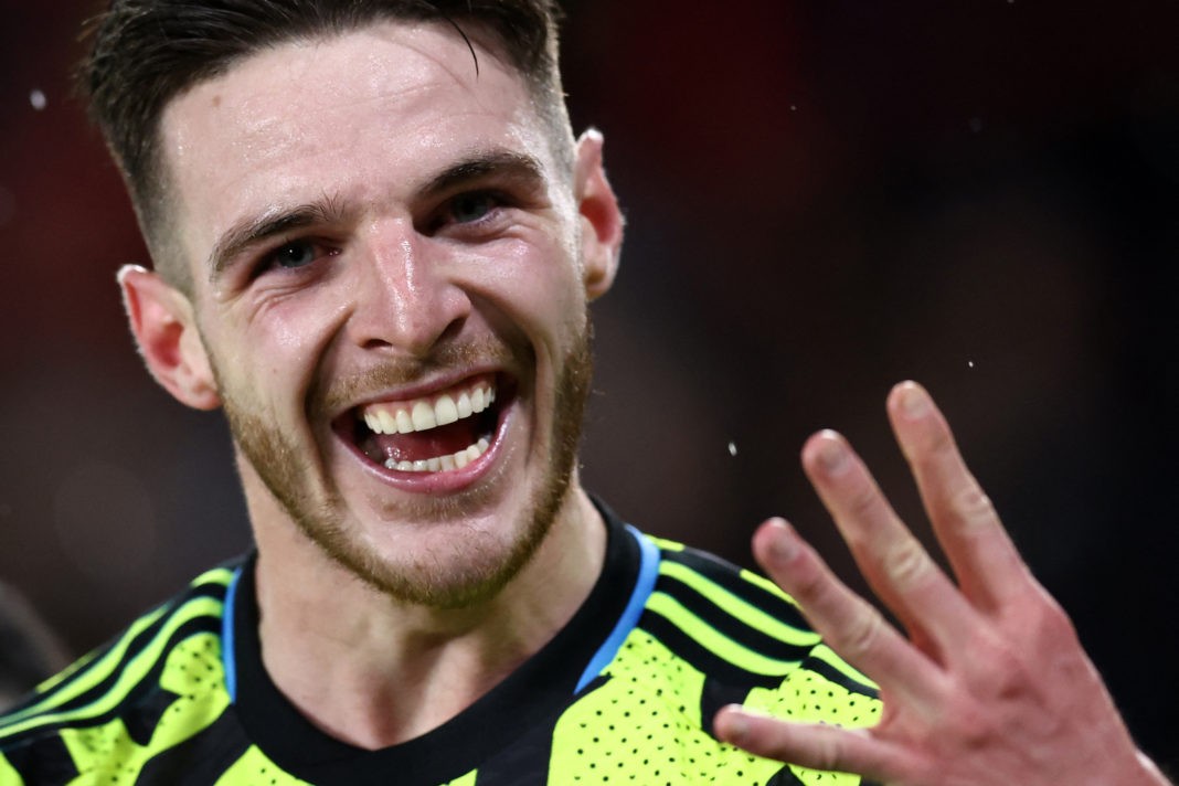 Arsenal's English midfielder #41 Declan Rice holds up his fingers as he celebrates scoring the team's fifth goal during the English Premier League football match between Sheffield United and Arsenal at Bramall Lane in Sheffield, northern England on March 4, 2024. (Photo by DARREN STAPLES/AFP via Getty Images)