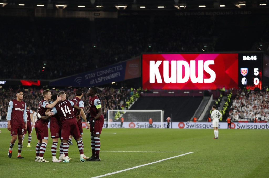 West Ham United's Ghanaian midfielder #14 Mohammed Kudus is mobbed by teammates after scoring the team's fifth goal during the UEFA Europa League round of 16 second leg football match between West Ham United and SC Freiburg at The London Stadium, in east London on March 14, 2024. (Photo by IAN KINGTON/AFP via Getty Images)