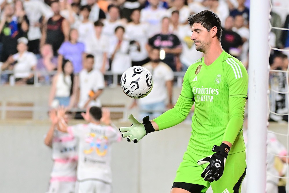 ORLANDO, FLORIDA: Thibaut Courtois of Real Madrid reacts after giving up a goal to Dušan Vlahović of Juventus in stoppage time during the pre-season friendly match at Camping World Stadium on August 02, 2023. (Photo by Julio Aguilar/Getty Images)