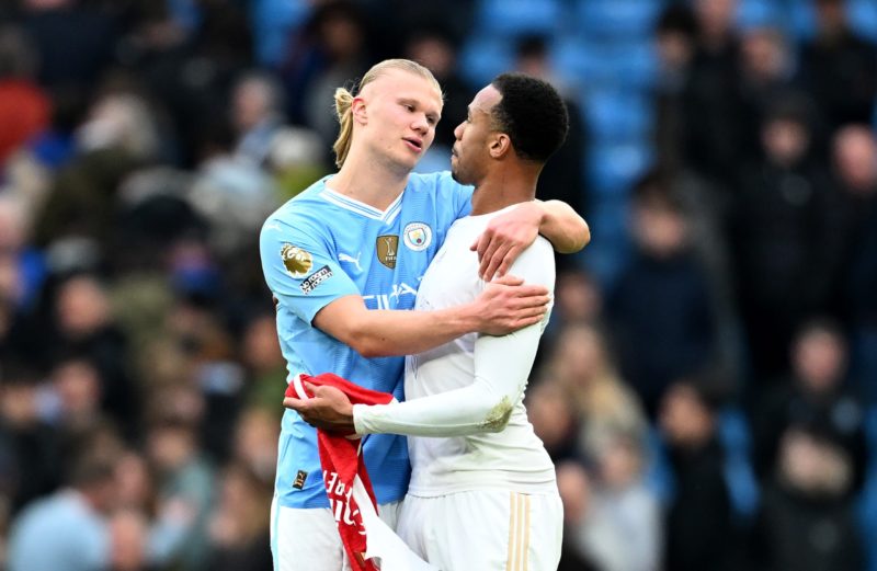 MANCHESTER, ENGLAND - MARCH 31: Erling Haaland of Manchester City interacts with Gabriel of Arsenal following the Premier League match between Manchester City and Arsenal FC at Etihad Stadium on March 31, 2024 in Manchester, England. (Photo by Michael Regan/Getty Images)