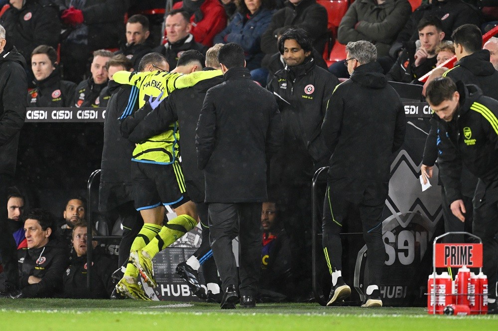 SHEFFIELD, ENGLAND: Gabriel Martinelli of Arsenal is helped off the pitch by medical staff after an injury during the Premier League match between Sheffield United and Arsenal FC at Bramall Lane on March 04, 2024. (Photo by Michael Regan/Getty Images)