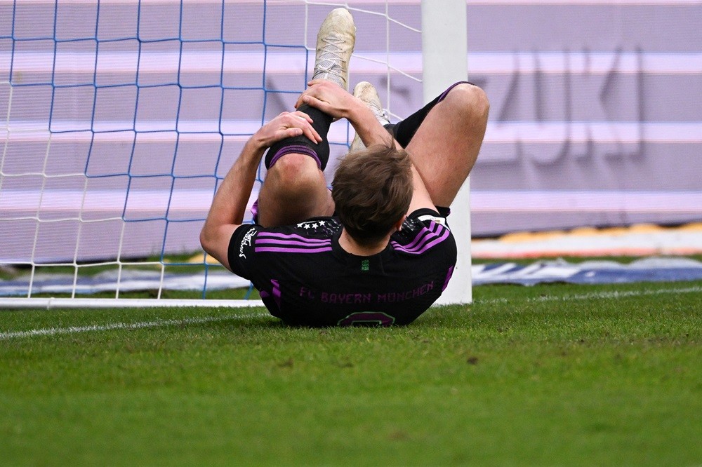 Bayern Munich's Harry Kane holds his leg after falling during the German first division Bundesliga football match between SV Darmstadt 98 and FC Bayern Munich in Darmstadt, western Germany on March 16, 2024. (Photo by KIRILL KUDRYAVTSEV/AFP via Getty Images)