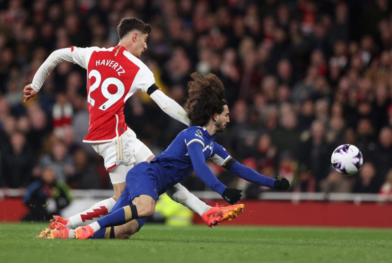 LONDON, ENGLAND - APRIL 23: Kai Havertz of Arsenal scores his team's third goal whilst under pressure from Marc Cucurella of Chelsea during the Premier League match between Arsenal FC and Chelsea FC at Emirates Stadium on April 23, 2024 in London, England. (Photo by Julian Finney/Getty Images)