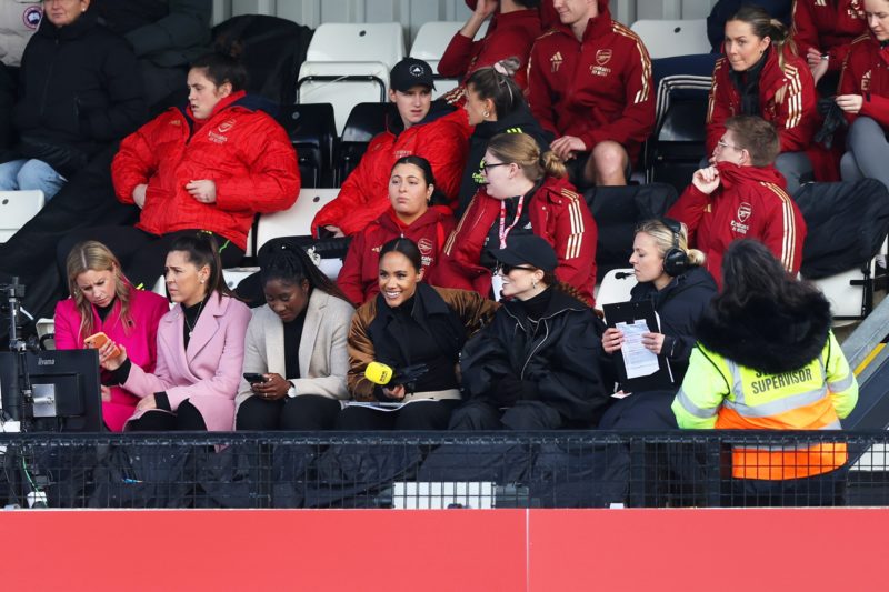 BOREHAMWOOD, ENGLAND - FEBRUARY 11: Alex Scott and Jess Glynne look on from the stands prior to the Adobe Women's FA Cup Fifth Round match between Arsenal and Manchester City at Meadow Park on February 11, 2024 in Borehamwood, England. (Photo by Richard Pelham/Getty Images)