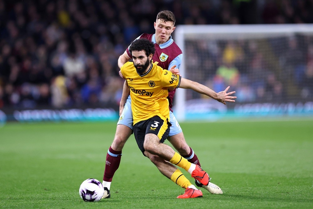 BURNLEY, ENGLAND: Rayan Ait-Nouri of Wolverhampton Wanderers is challenged by Dara O'Shea of Burnley during the Premier League match between Burnley FC and Wolverhampton Wanderers at Turf Moor on April 02, 2024. (Photo by Alex Livesey/Getty Images)