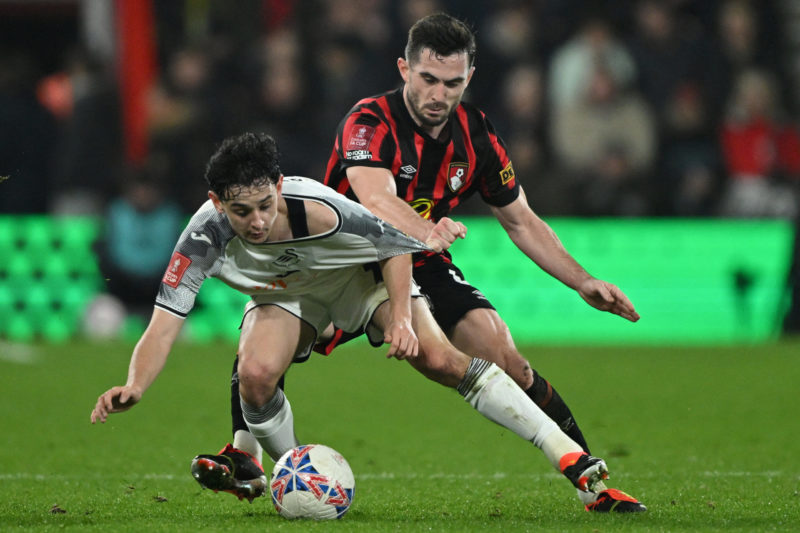 Bournemouth's English midfielder #04 Lewis Cook (R) fouls Swansea City's English midfielder #18 Charlie Patino (L) during the English FA Cup fourth round football match between Bournemouth and Swansea City at the Vitality Stadium in Bournemouth, southern England on January 25, 2024. (Photo by JUSTIN TALLIS/AFP via Getty Images)