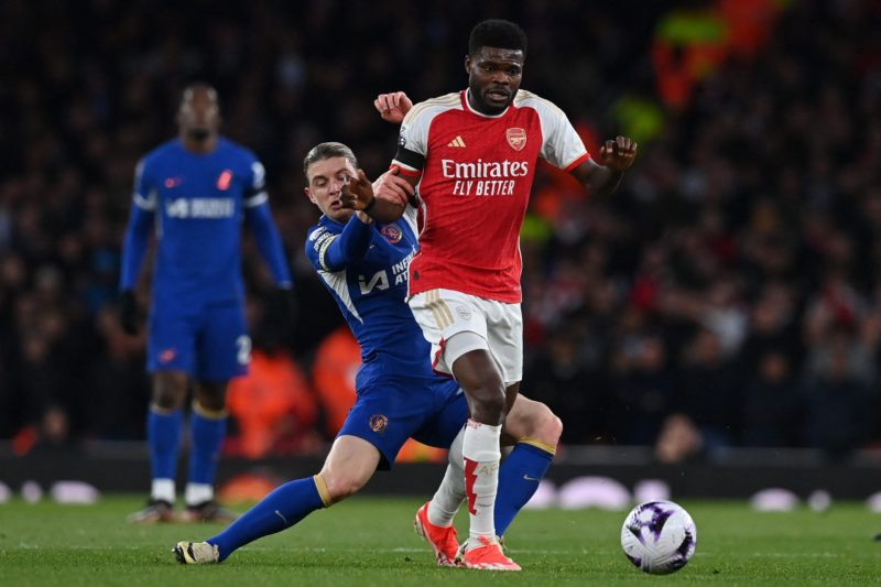 Arsenal's Ghanaian midfielder #05 Thomas Partey (R) vies with Chelsea's English midfielder #23 Conor Gallagher (C) during the English Premier League football match between Arsenal and Chelsea at the Emirates Stadium in London on April 23, 2024. (Photo by GLYN KIRK/AFP via Getty Images)