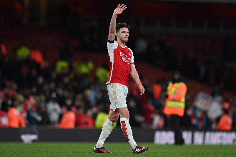 Arsenal's English midfielder #41 Declan Rice waves to fans on the pitch after the English Premier League football match between Arsenal and Chelsea at the Emirates Stadium in London on April 23, 2024. Arsenal won the game 5-0. (Photo by GLYN KIRK/AFP via Getty Images)