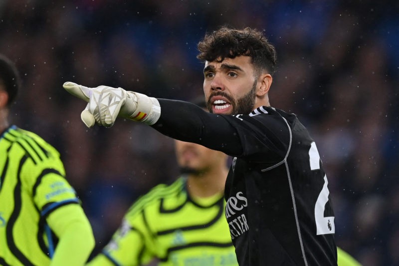 Arsenal's Spanish goalkeeper #22 David Raya gestures during the English Premier League football match between Brighton and Hove Albion and Arsenal at the American Express Community Stadium in Brighton, southern England on April 6, 2024. (Photo by GLYN KIRK/AFP via Getty Images)
