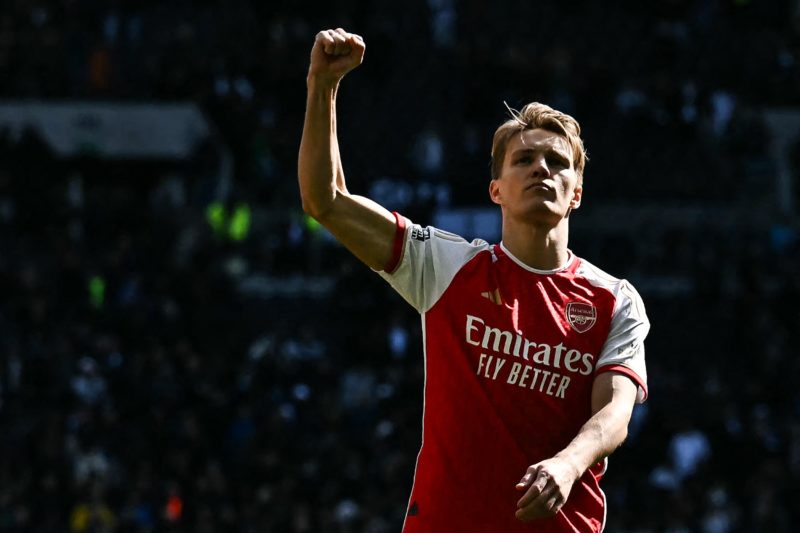 Arsenal's Norwegian midfielder #08 Martin Odegaard celebrates at the end of during the English Premier League football match between Tottenham Hotspur and Arsenal at the Tottenham Hotspur Stadium in London, on April 28, 2024. Arsenal wins 3 - 2 against Tottenham Hotspur. (Photo by BEN STANSALL/AFP via Getty Images)