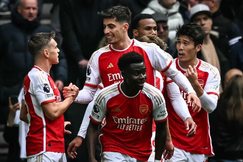 Arsenal's German midfielder #29 Kai Havertz (rear C) celebrates with teammates after scoring his team third goal during the English Premier League football match between Tottenham Hotspur and Arsenal at the Tottenham Hotspur Stadium in London, on April 28, 2024. (Photo by BEN STANSALL/AFP via Getty Images)