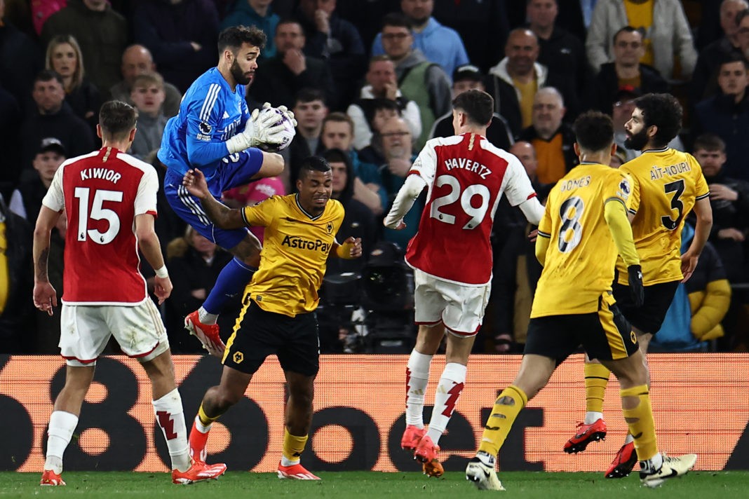 Wolverhampton Wanderers' Mario Lemina (centre left) is hurt in this collision with Arsenal's David Raya (2L) during the English Premier League football match between Wolverhampton Wanderers and Arsenal at the Molineux stadium in Wolverhampton, central England on April 20, 2024. (Photo by HENRY NICHOLLS/AFP via Getty Images)