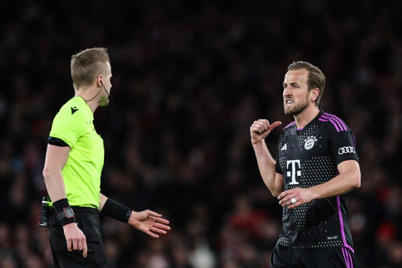 Bayern Munich's English striker #09 Harry Kane (R) argues with the referee during the UEFA Champions League quarter final first-leg football match between Arsenal and Bayern Munich at the Arsenal Stadium, in north London, on April 9, 2024. (Photo by ADRIAN DENNIS/AFP via Getty Images)