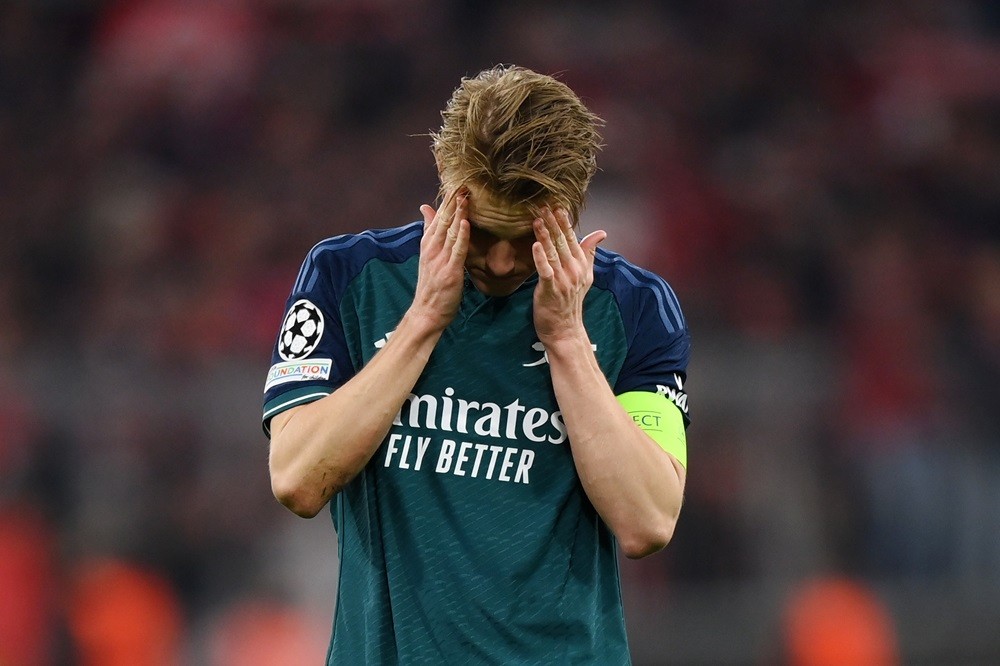 MUNICH, GERMANY: Martin Odegaard of Arsenal looks dejected after the team's defeat and elimination from the UEFA Champions League during the UEFA Champions League quarter-final second leg match between FC Bayern München and Arsenal FC at Allianz Arena on April 17, 2024. (Photo by Justin Setterfield/Getty Images)