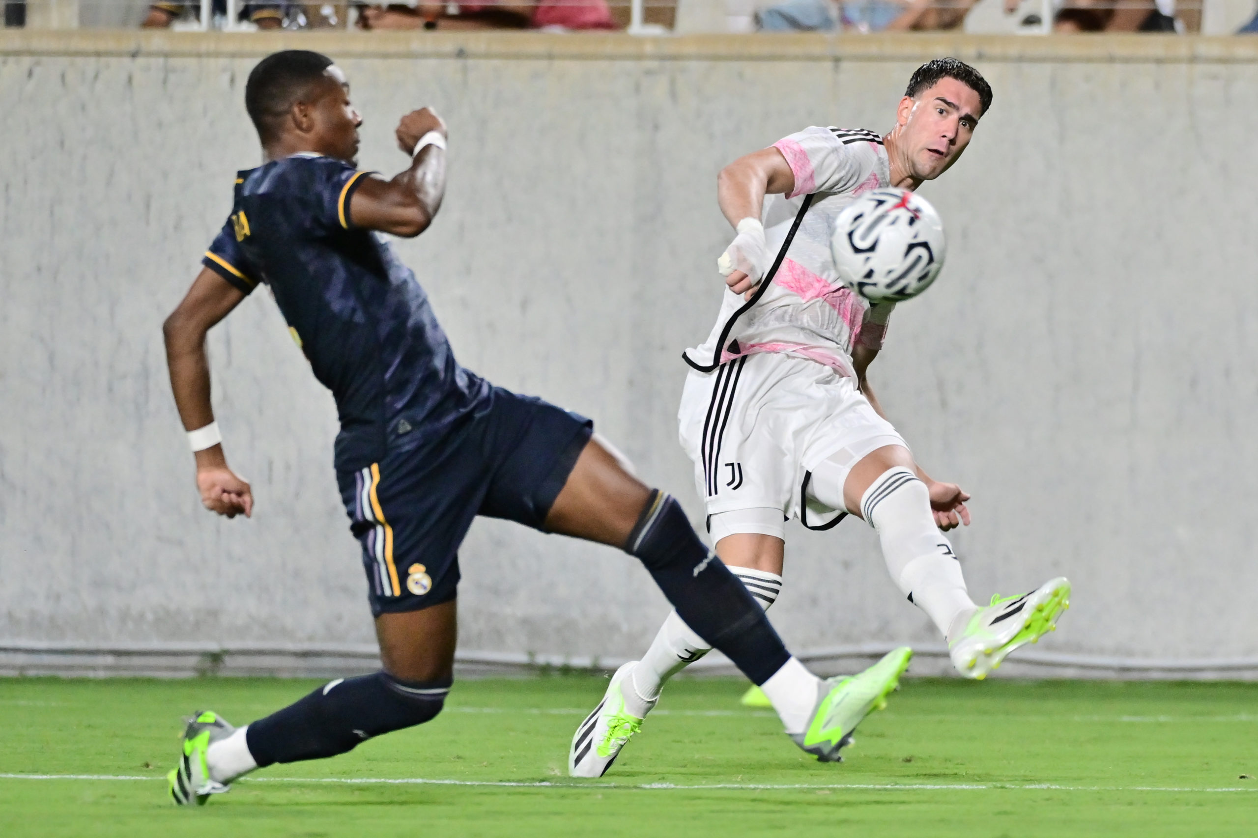ORLANDO, FLORIDA - AUGUST 02: Dušan Vlahović #9 of Juventus passes the ball against David Alaba #4 of Real Madrid in the second half of a pre-season friendly match at Camping World Stadium on August 02, 2023 in Orlando, Florida. (Photo by Julio Aguilar/Getty Images)