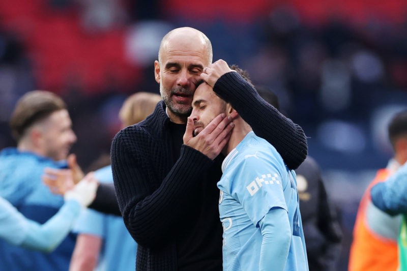 LONDON, ENGLAND - APRIL 20: Pep Guardiola and Bernardo Silva of Manchester City celebrate after the team's victory during the Emirates FA Cup Semi Final match between Manchester City and Chelsea at Wembley Stadium on April 20, 2024 in London, England. (Photo by Alex Pantling/Getty Images)