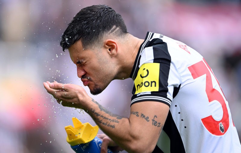 NEWCASTLE UPON TYNE, ENGLAND - APRIL 13: Newcastle United player Bruno Guimaraes sprays his face with water before the Premier League match between Newcastle United and Tottenham Hotspur at St. James Park on April 13, 2024 in Newcastle upon Tyne, England. (Photo by Stu Forster/Getty Images)